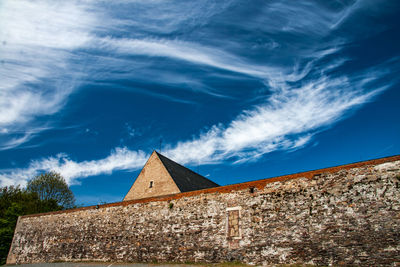 Low angle view of building against blue sky