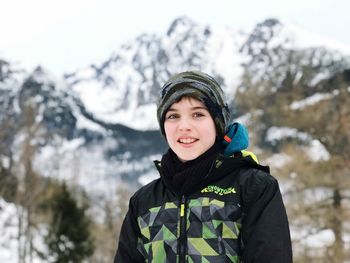 Portrait of smiling woman in snow