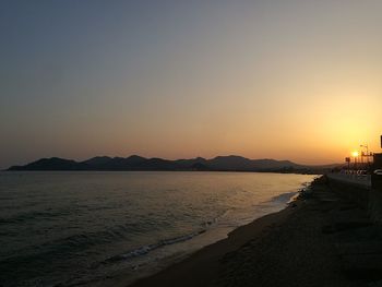 Scenic view of beach against sky during sunset
