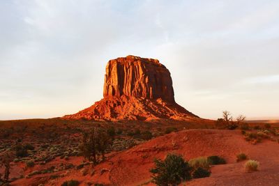 Rock formations on landscape against sky