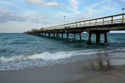 View of pier over sea against sky