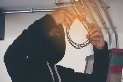 Burglar installing in cables