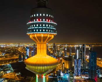 Illuminated modern buildings in city at night