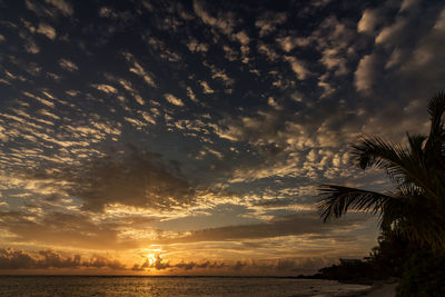 Scenic view of sea against sky at sunset