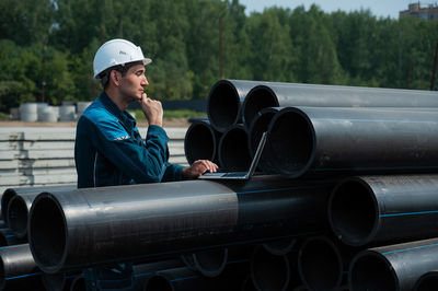 Side view of man working in factory