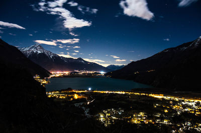 Scenic view of illuminated mountains against sky at night