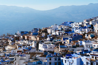 High angle view of townscape by sea