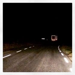 Car on road at night