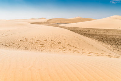 Scenic view of desert against clear sky