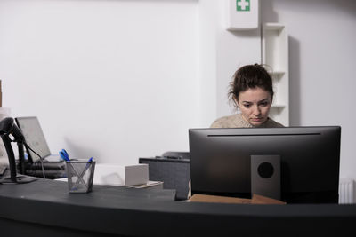 Businesswoman using laptop at home