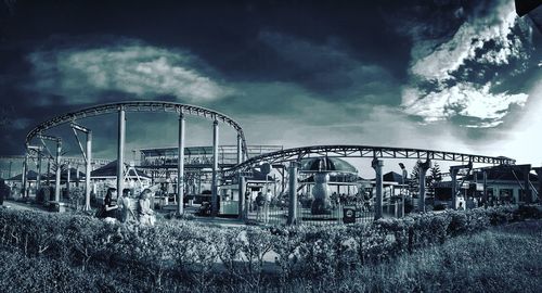 Low angle view of amusement park ride against sky