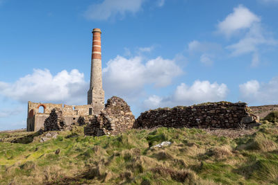 Landscape photo of an abandoned building from the mining industry on the cornish caost