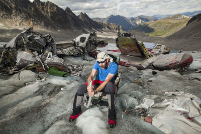 Man at airplane crash, bomber glacier, talkeetna mountains, alaska