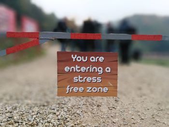 Close-up of warning sign on field