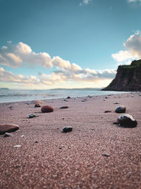 Surface level of beach against sky
