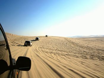 Scenic view of desert against clear sky