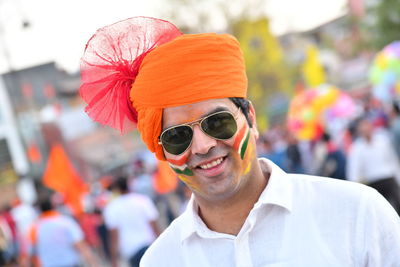 Portrait of smiling man wearing turban and sunglasses