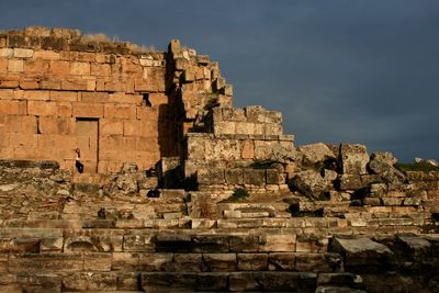 Young woman at historic old ruins