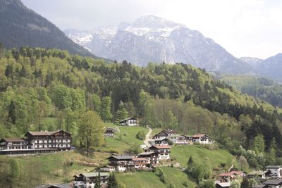 Houses and mountains against sky