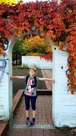 Full length portrait of boy in park during autumn