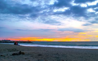 Scenic view of sea against cloudy sky