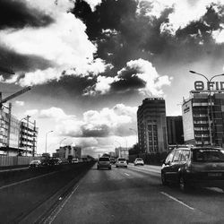 City street against cloudy sky