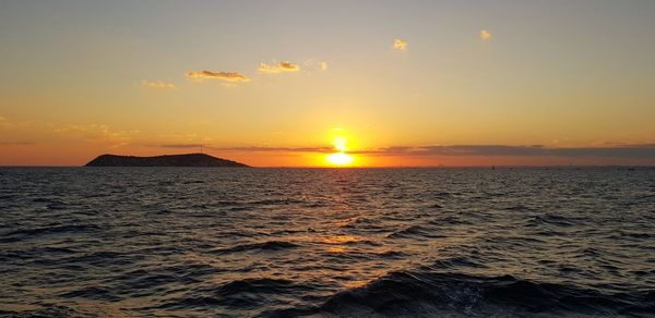 Scenic view of sea against sky during sunset