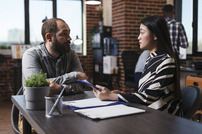 Businessman talking interview of candidate