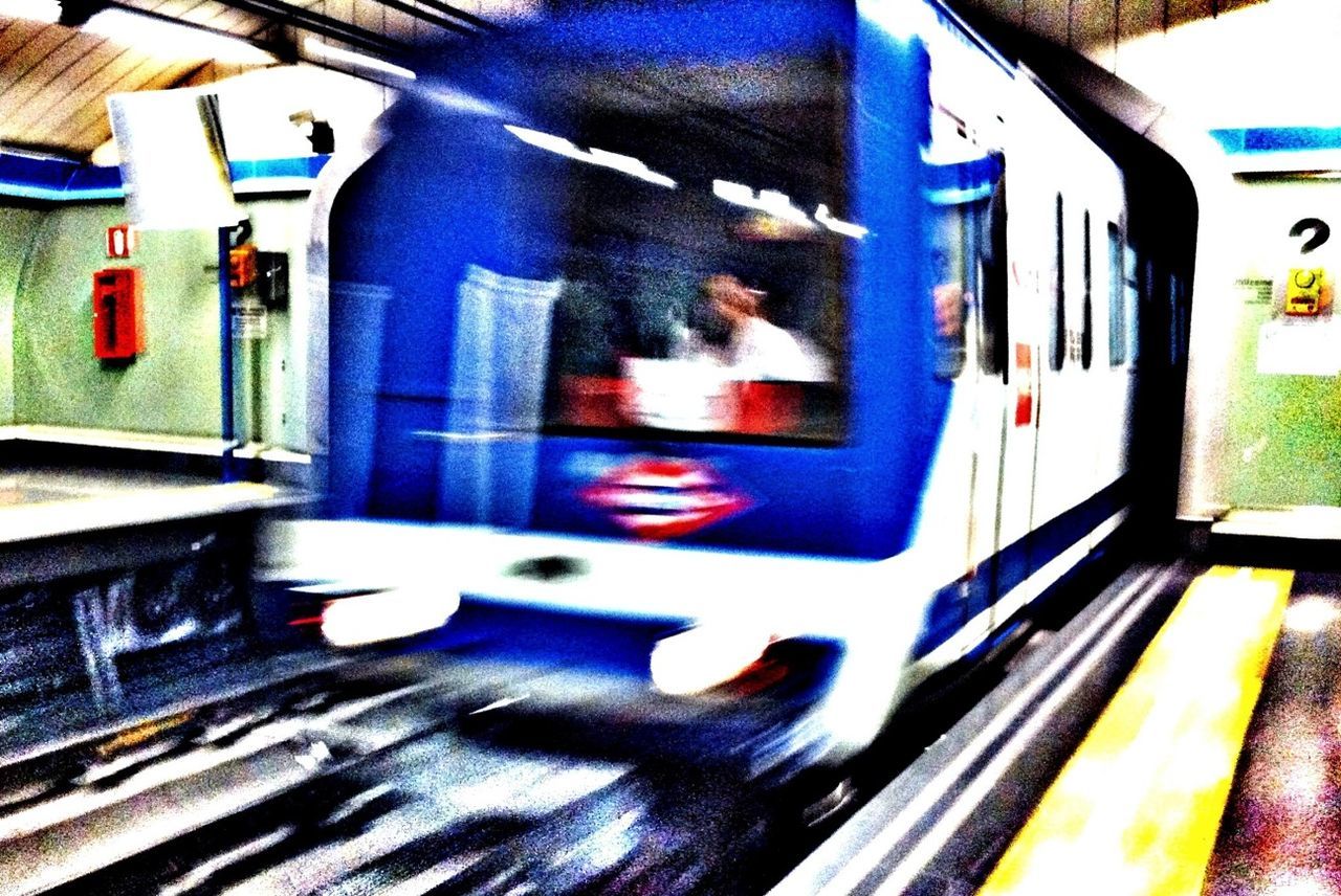 indoors, blue, window, glass - material, multi colored, reflection, transportation, graffiti, transparent, public transportation, men, vehicle interior, incidental people, door, day, high angle view, mode of transport, interior