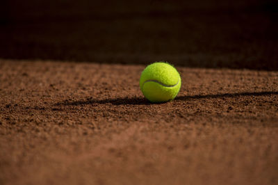 Tennis ball on field