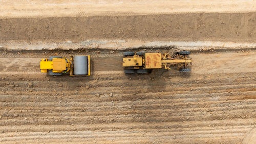 Aerial view motor grader civil at construction site, motor grader work on construction site, road