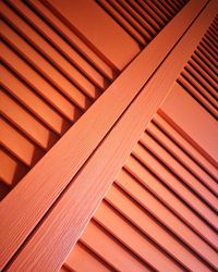 Full frame shot of orange wooden door