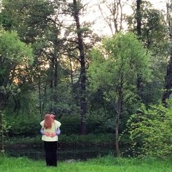 Man standing on tree trunk