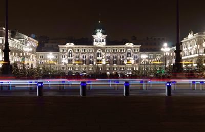 Illuminated city buildings at night