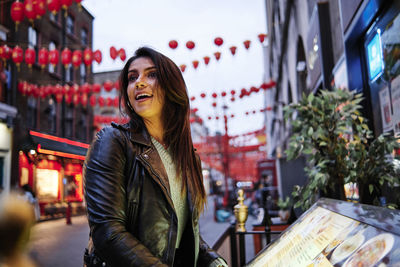 Woman standing on a city