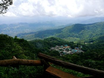 Scenic view of mountains against cloudy sky