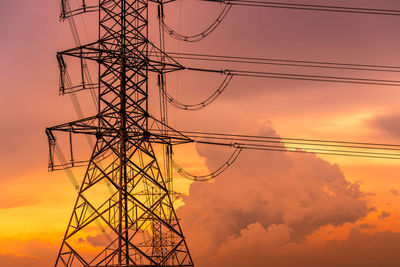 High voltage electric pylon and electrical wire with sunset sky. electricity pole. power and energy.