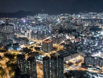 High angle view of illuminated city buildings at night