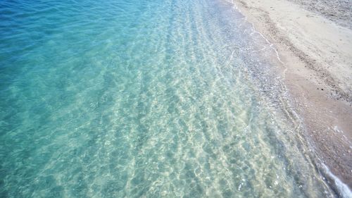 High angle view of waves on beach