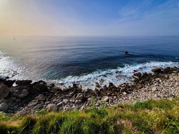 Lush sicilian coastline at sunset