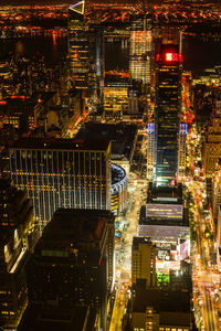 High angle view of illuminated buildings in city at night