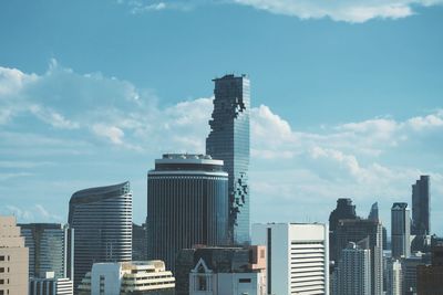 Modern buildings in city against sky