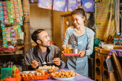 Friends having food at restaurant