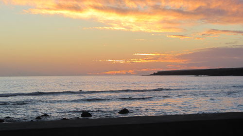 Scenic view of sunset over sea