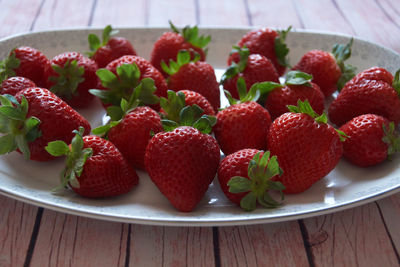 High angle view of strawberries in plate on table