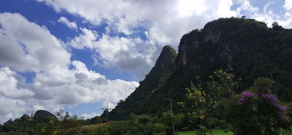 Low angle view of panoramic shot of land against sky