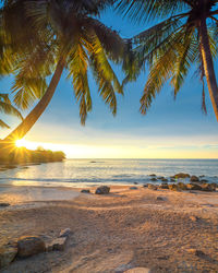 Scenic view of sea against sky at sunset