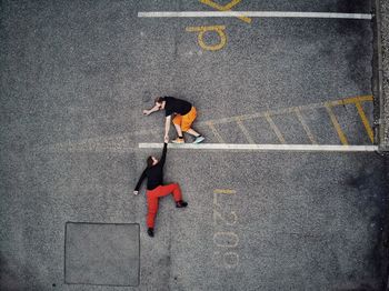 High angle view of woman running on road