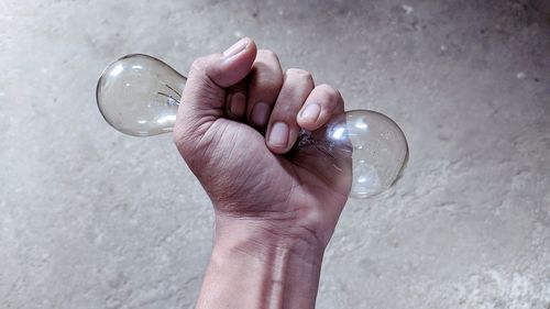 Close-up of hand holding glass