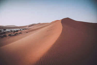 Scenic view of desert against clear sky